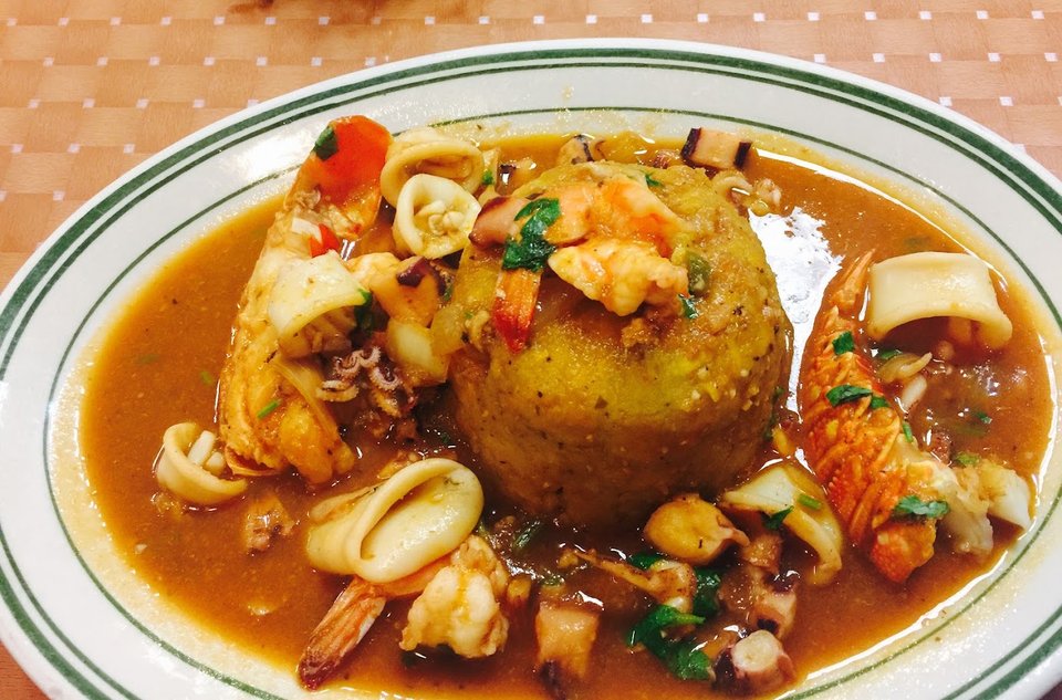Seafood dishes on a casual restaurant table.